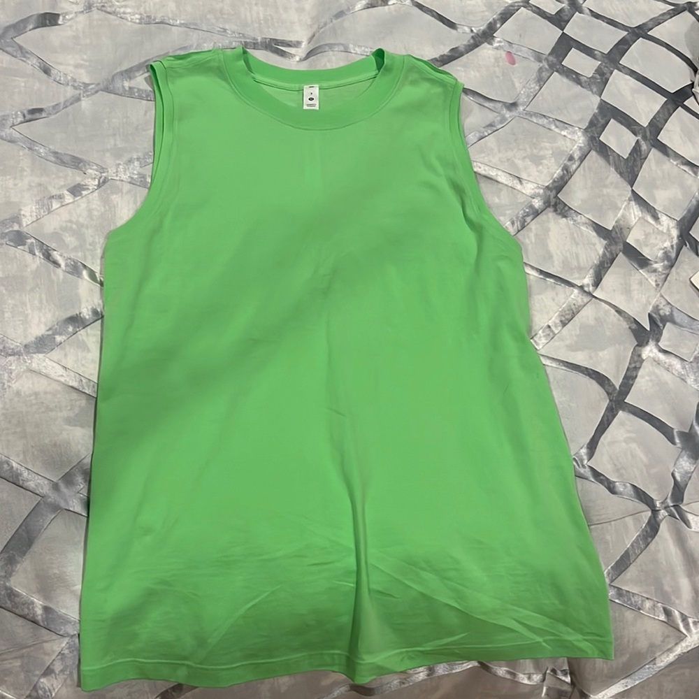 I’m selling a brand new LuLuLemon green tank top.